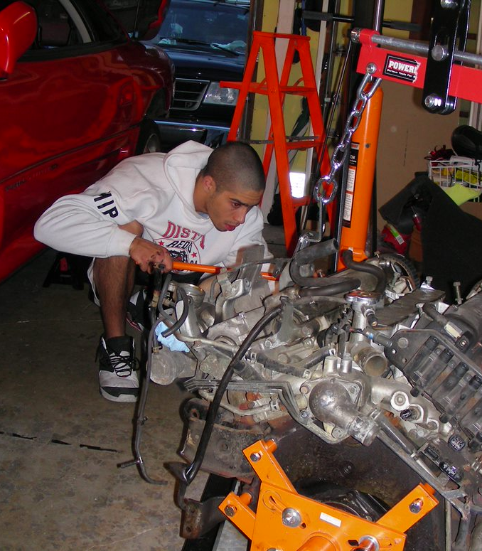 Michael working on an engine in college